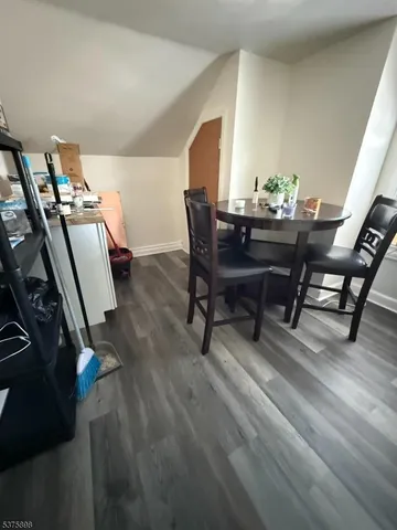 a view of a wooden deck with a yard