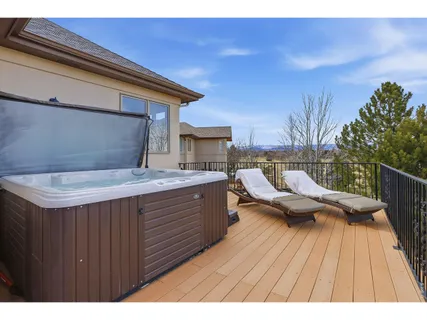 a terrace with outdoor seating and wooden floor