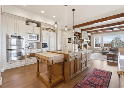 a kitchen with stainless steel appliances granite countertop a stove and a refrigerator