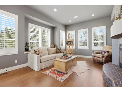 a living room with furniture and windows