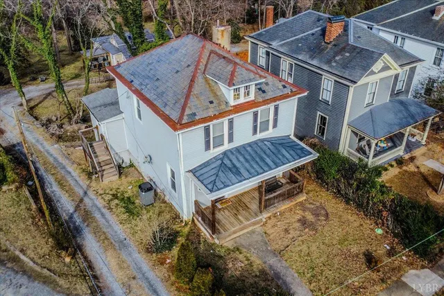 a view of a house with roof deck and sitting area