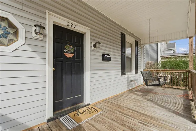 a view of a door and chair in the balcony