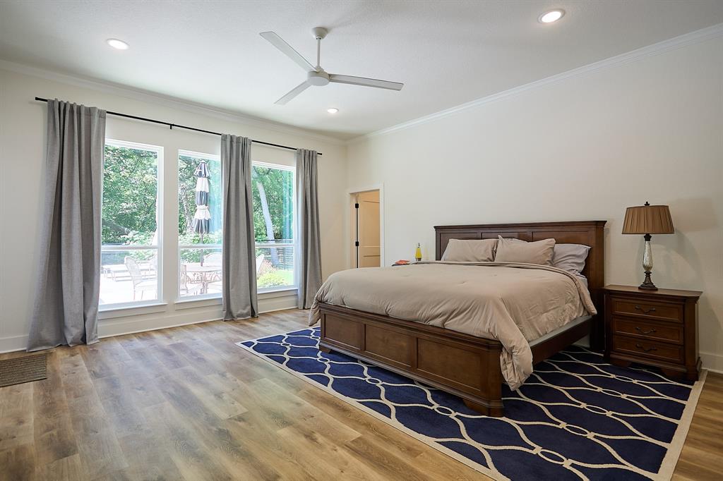 358 Glade Valley Road Azle, TX 76020 - Photo 11 of 35 Spacious bedroom featuring wood-finish flooring, a contemporary ceiling fan, recessed lighting, and crown molding
