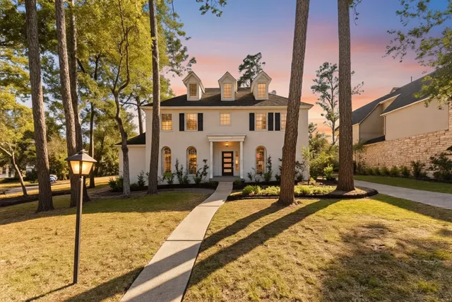 a view of a house with snow on the road