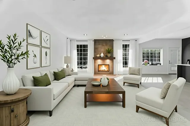 an empty room with windows and fireplace