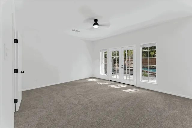 a bathroom with a tub a double vanity sink a mirror and a bathtub
