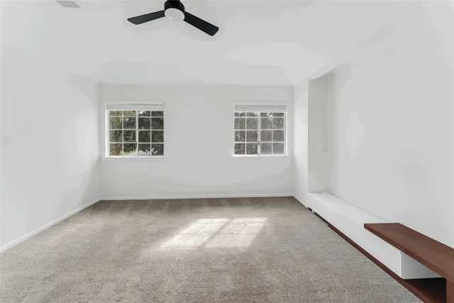 a bedroom with a bed and a table