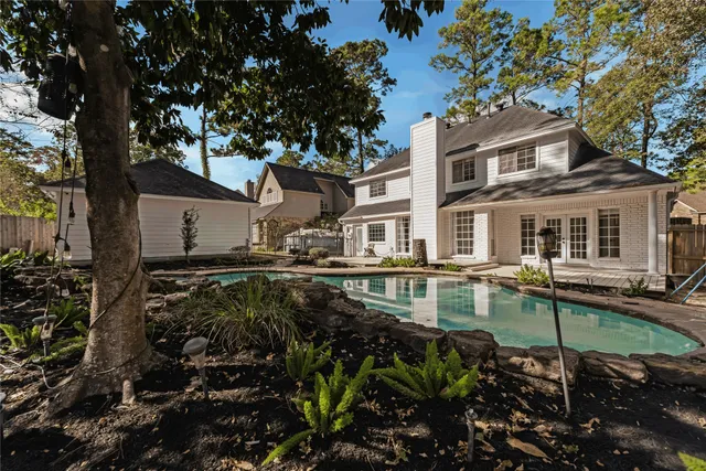 a house with trees in the background