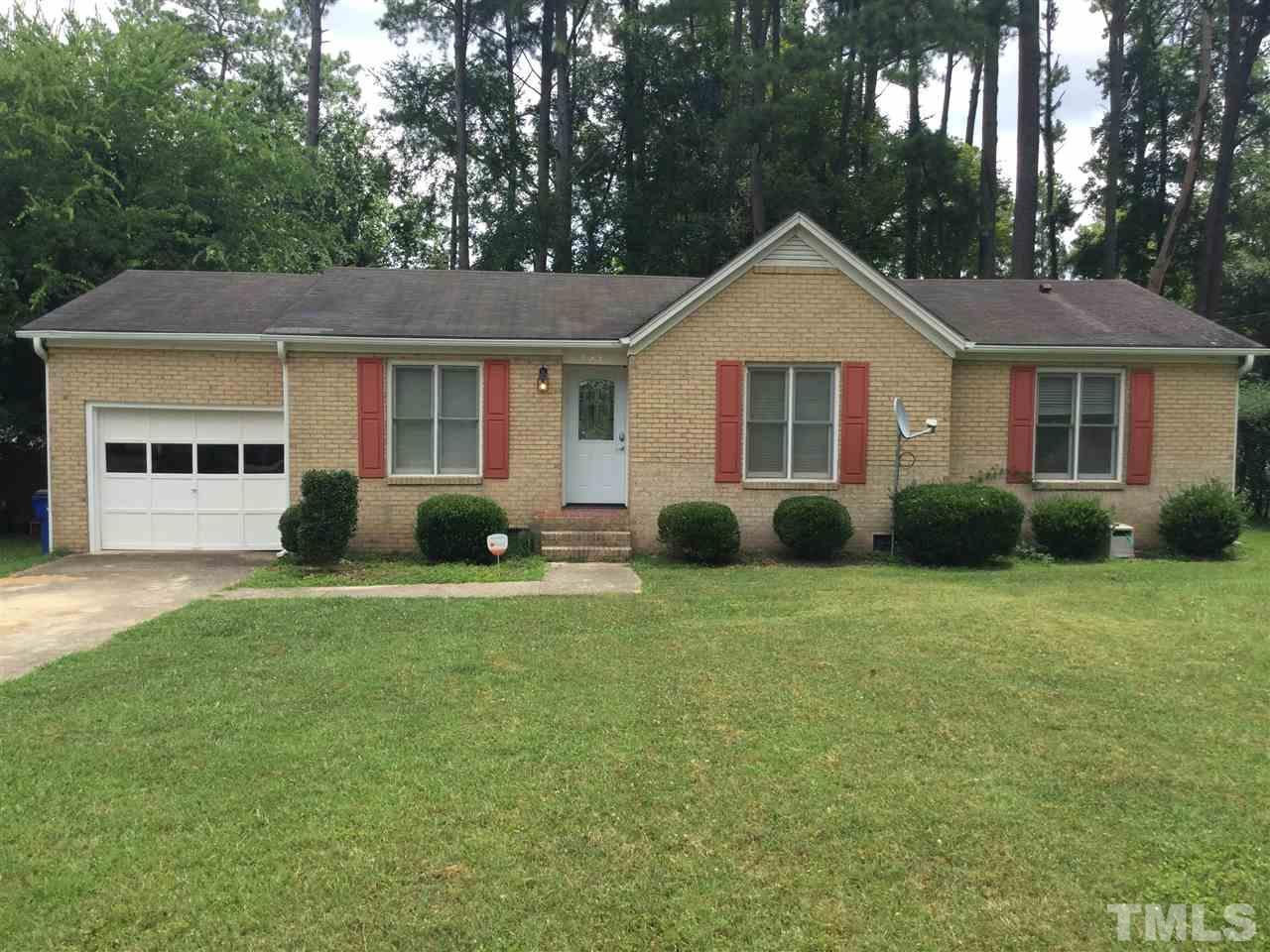 1522 Bennett Street Raleigh, NC 27604 - Photo 1 of 12 a front view of a house with a yard