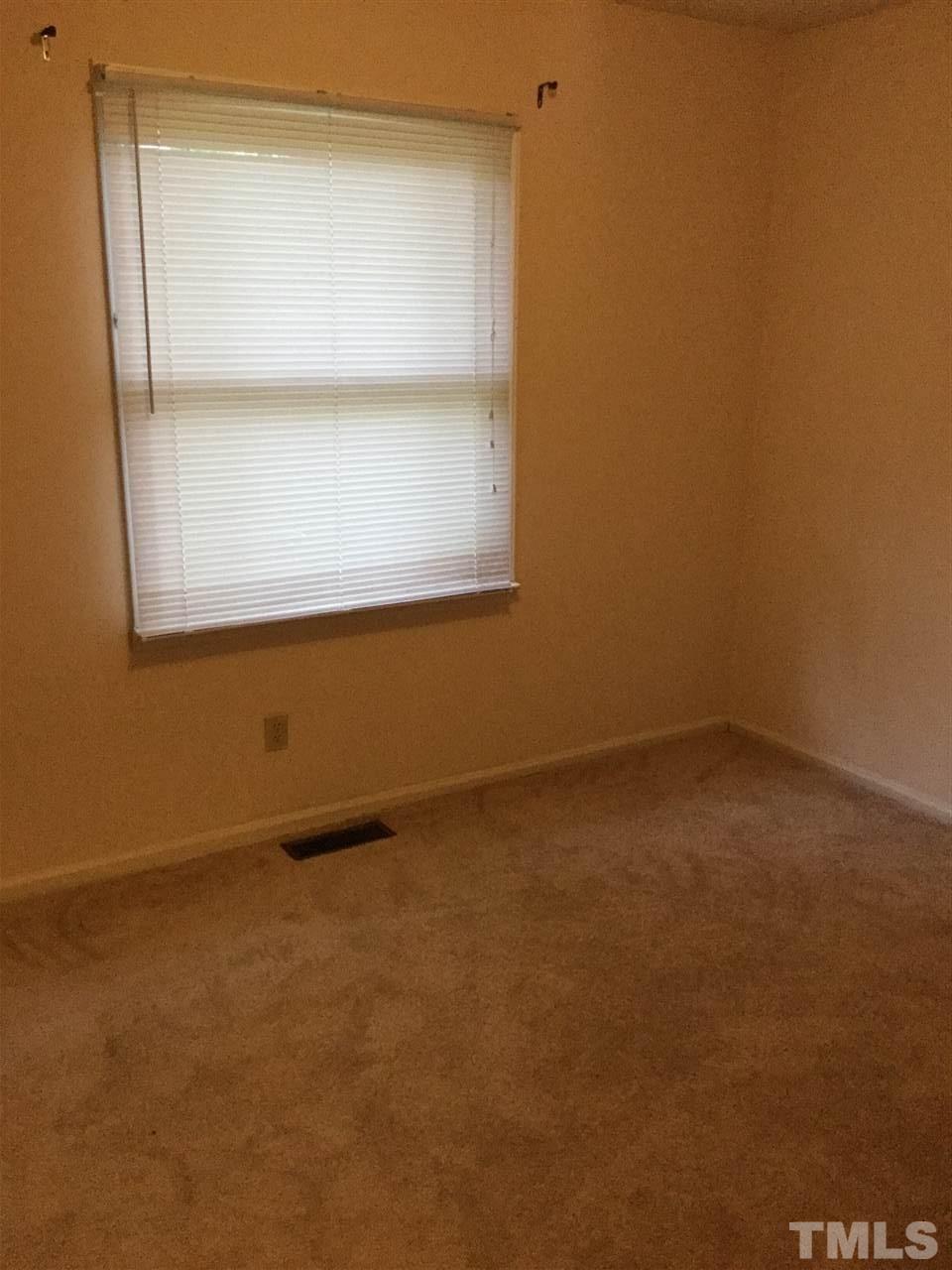 1522 Bennett Street Raleigh, NC 27604 - Photo 8 of 12 an empty room with a window