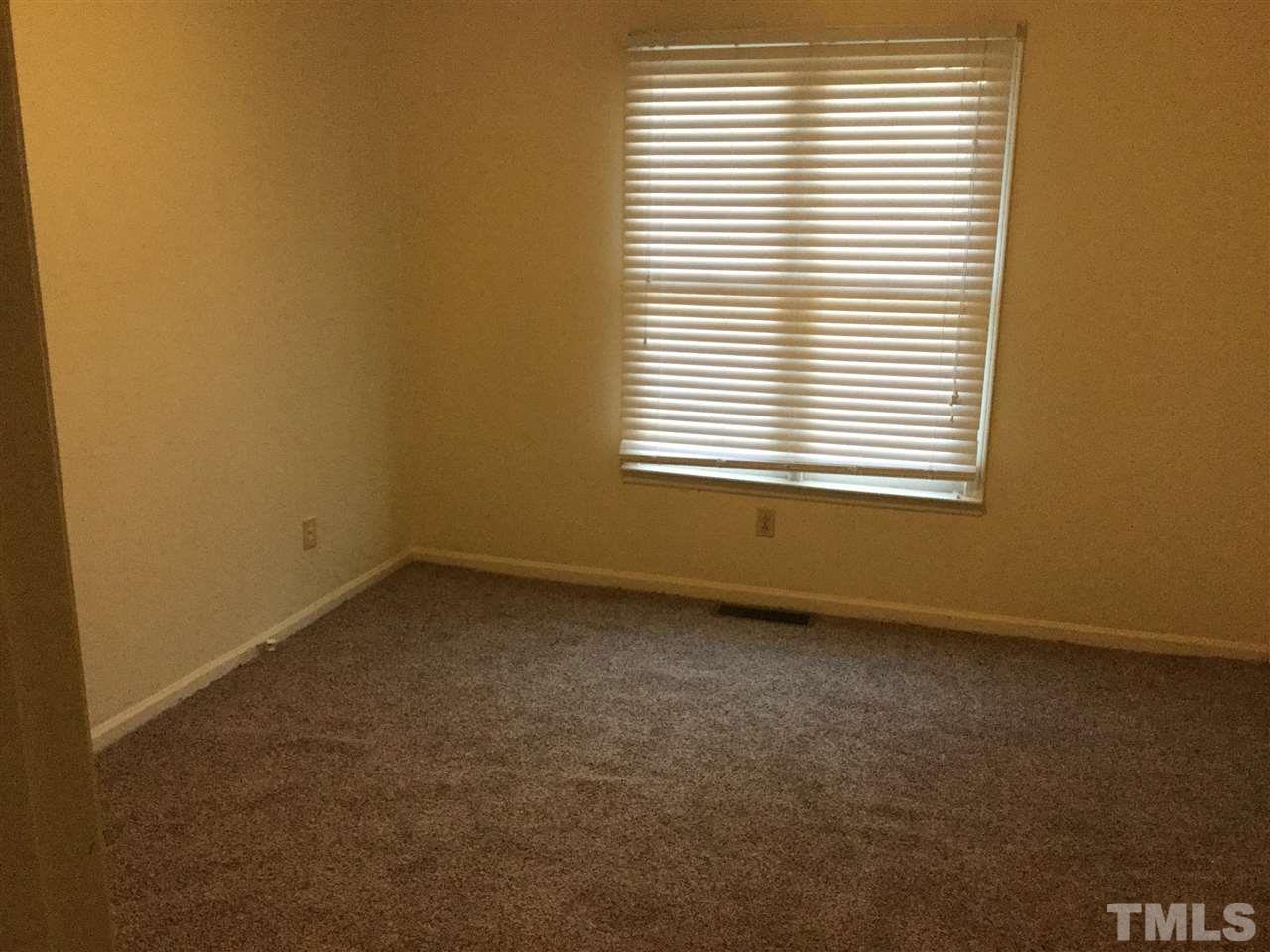 1522 Bennett Street Raleigh, NC 27604 - Photo 9 of 12 an empty room with a window