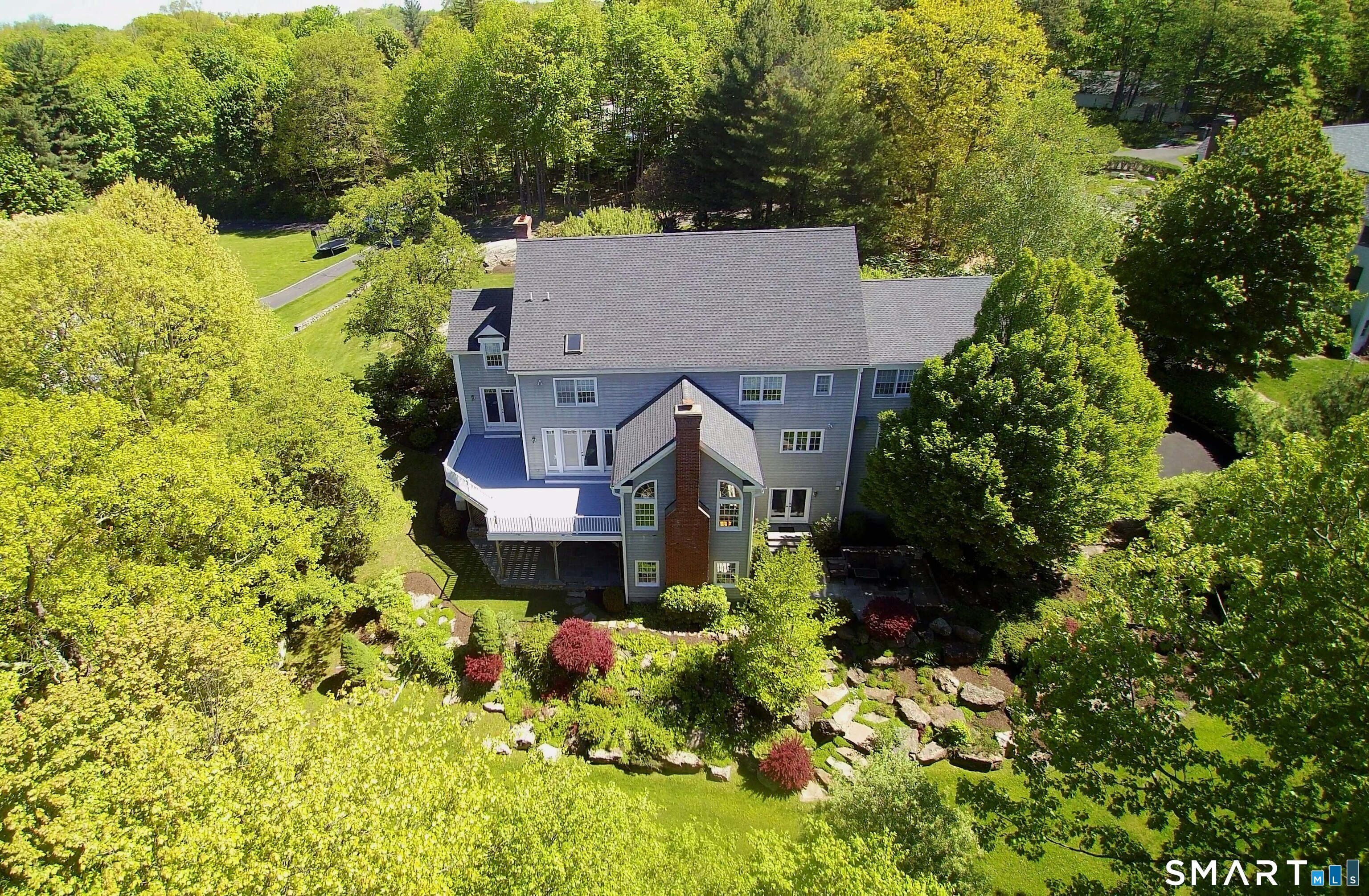 30 Whipstick Road Ridgefield, CT 06877 - Photo 3 of 40 an aerial view of a house with a yard and garden