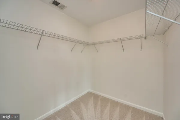 a bathroom with a sink double vanity granite tub shower and a mirror