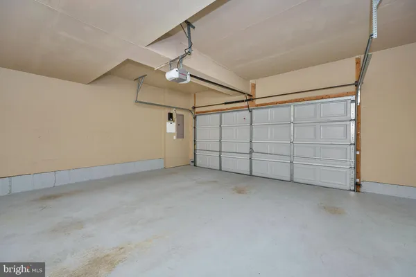 a front view of a house with yard and green space