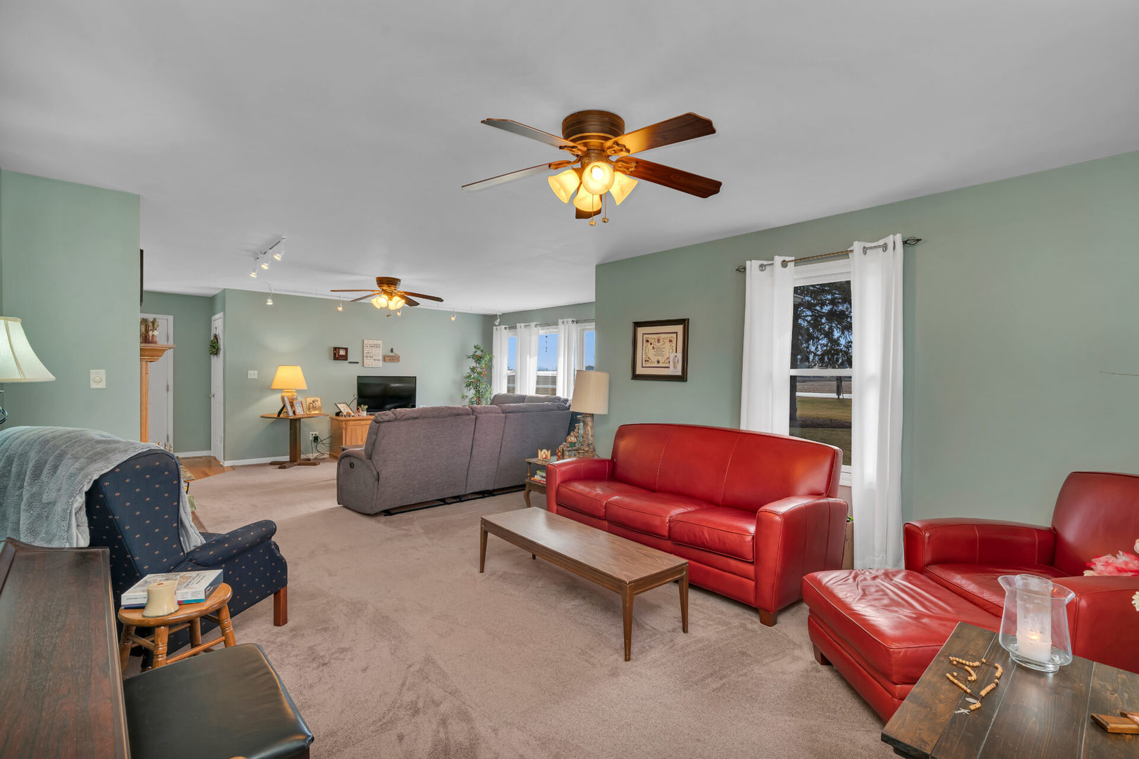 19556 West Manhattan Road Elwood, IL 60421 - Photo 12 of 23 a living room with furniture a couch and a dining table