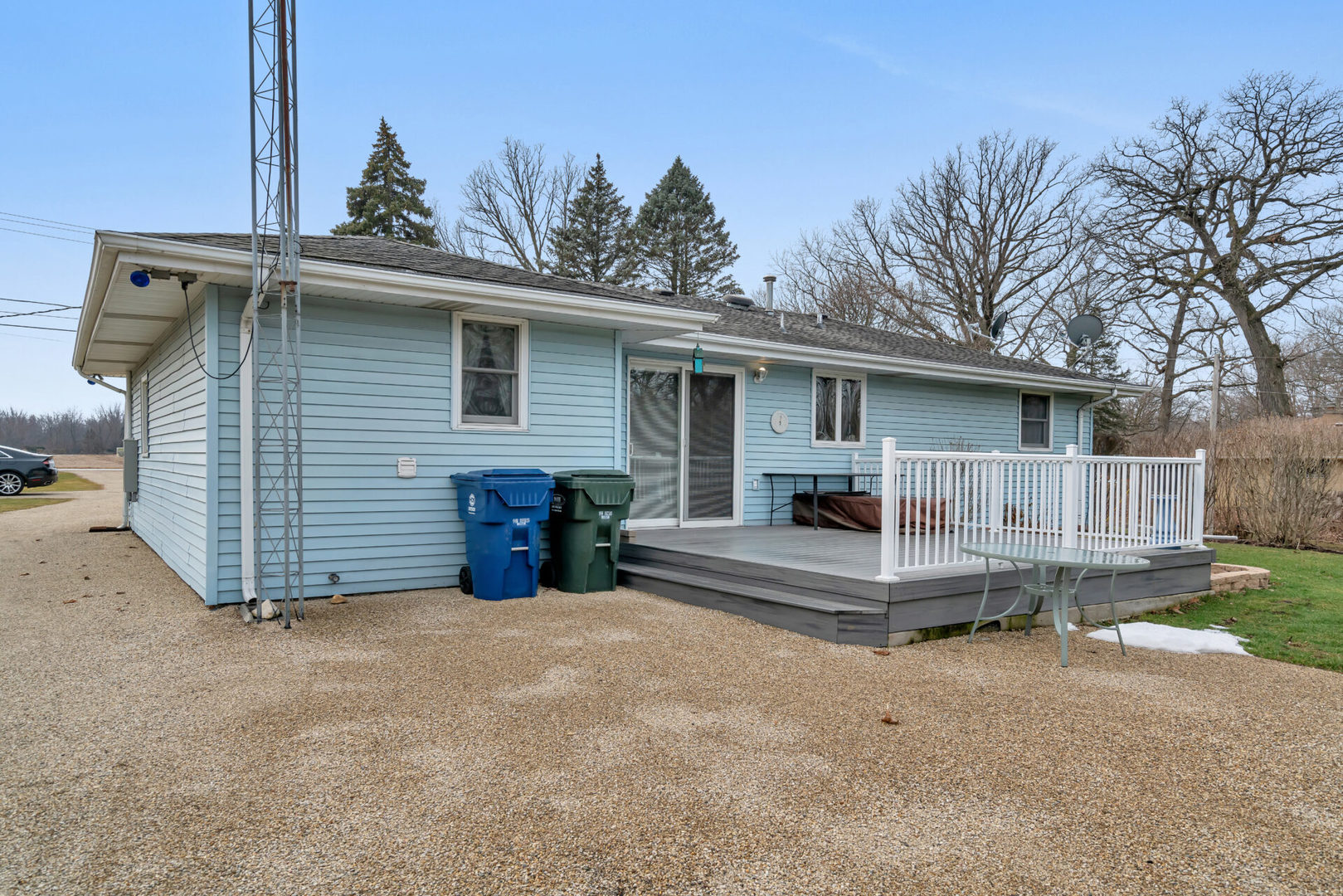 19556 West Manhattan Road Elwood, IL 60421 - Photo 7 of 23 a view of a house with a yard and wooden fence