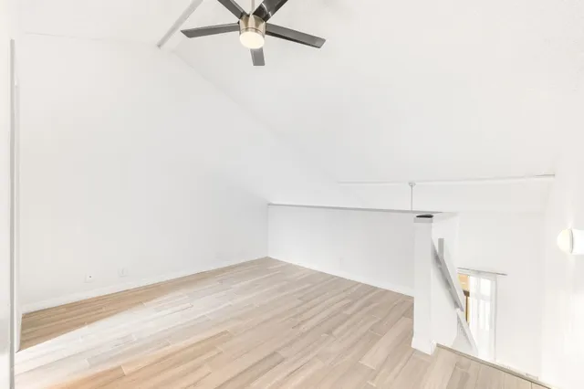 an aerial view of a house with a lake view