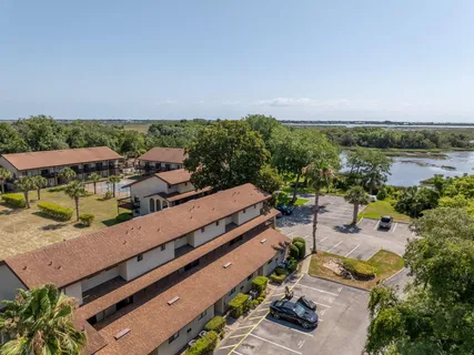 an aerial view of a house with lake view