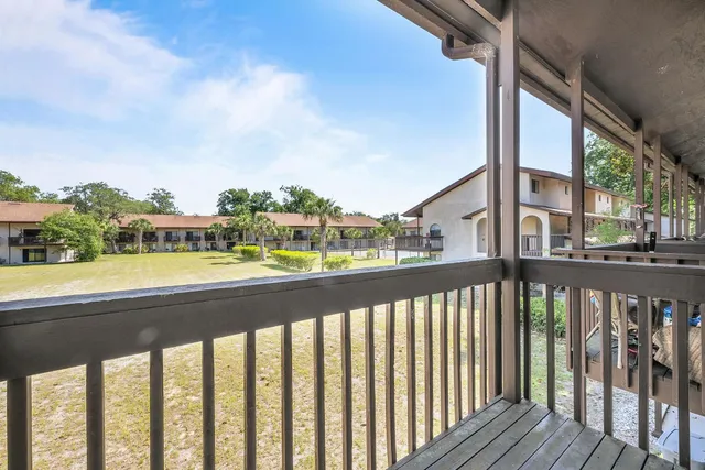 an aerial view of a house with a lake view