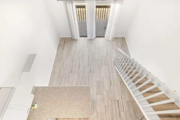 a view of a room with utility room and wooden floor