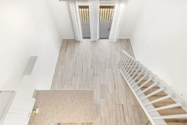 a view of a room with utility room and wooden floor