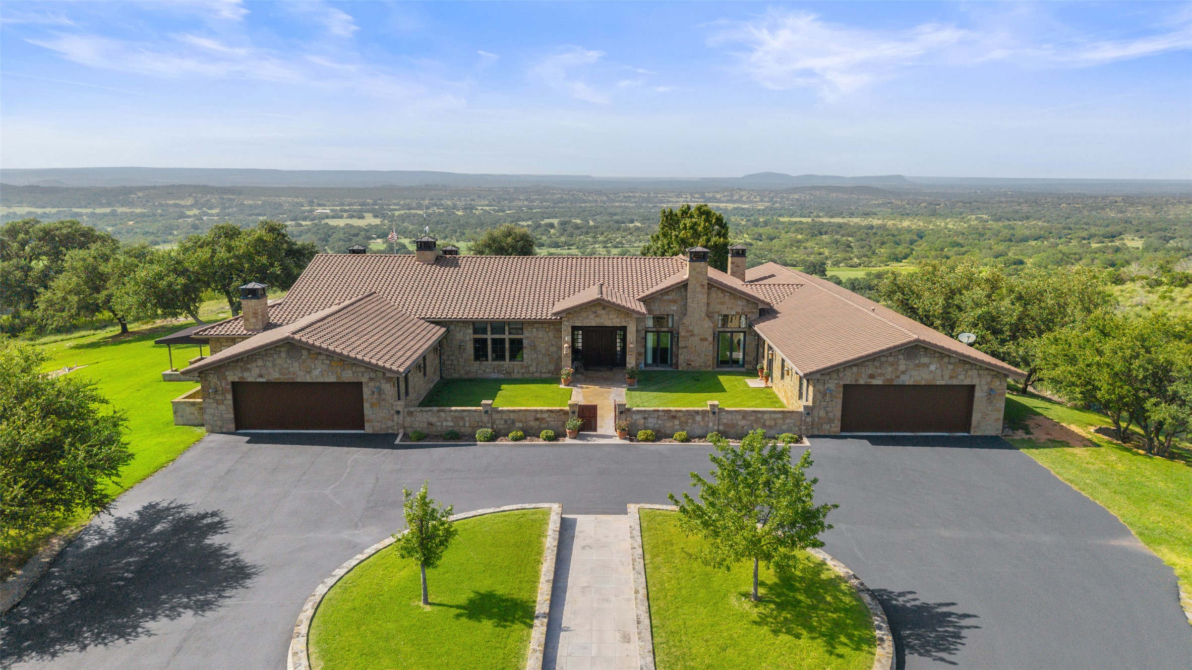 4529 Ranch Road 3347 Round Mountain, TX 78663 - Photo 2 of 36 a aerial view of a house with a big yard and large trees