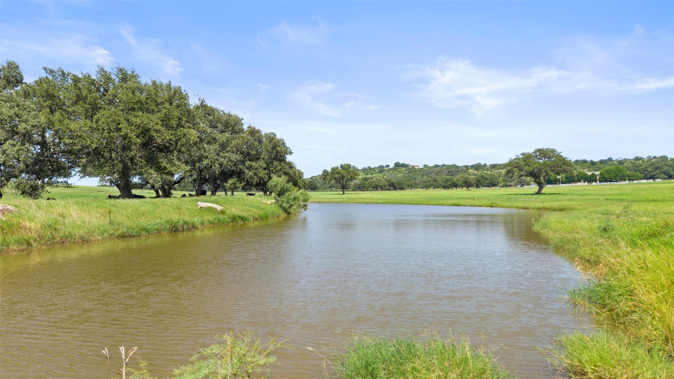 4529 Ranch Road 3347 Round Mountain, TX 78663 - Photo 27 of 36 a view of a lake with a yard