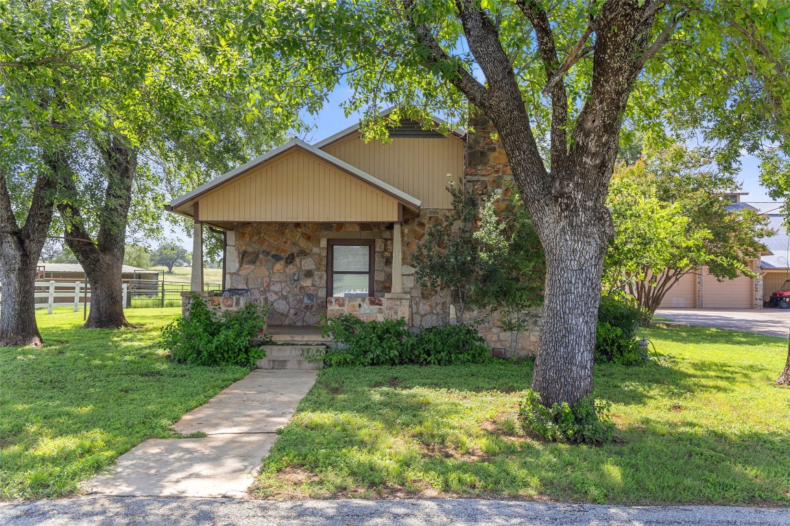 4529 Ranch Road 3347 Round Mountain, TX 78663 - Photo 28 of 36 a front view of a house with garden