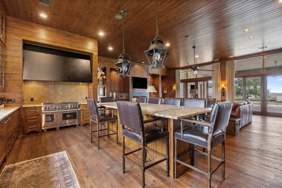 4529 Ranch Road 3347 Round Mountain, TX 78663 - Photo 7 of 36 a dining room with furniture and a flat screen tv