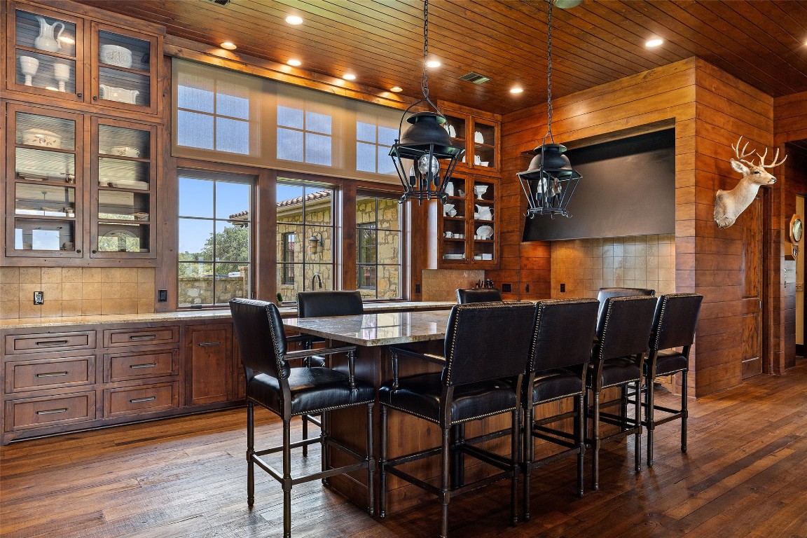 4529 Ranch Road 3347 Round Mountain, TX 78663 - Photo 9 of 36 a view of a dining room with furniture window and wooden floor