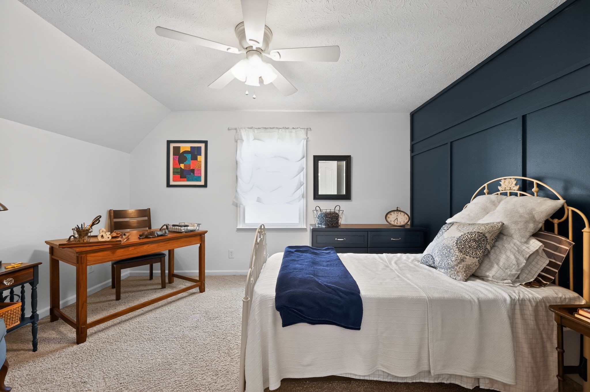 190 Hooper Road Smithville, TN 37166 - Photo 20 of 32 a bedroom with a bed and a chandelier