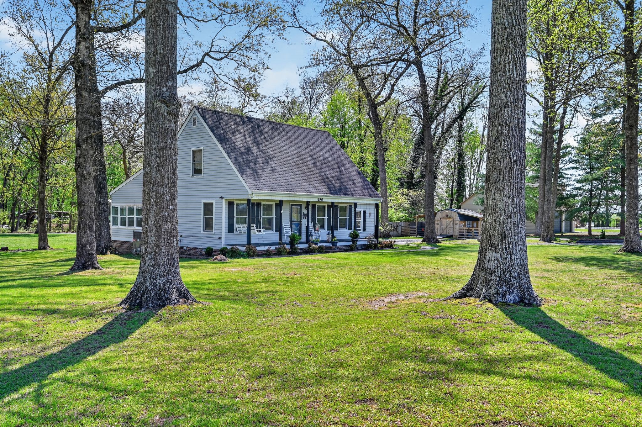 190 Hooper Road Smithville, TN 37166 - Photo 2 of 32 a front view of a house with garden