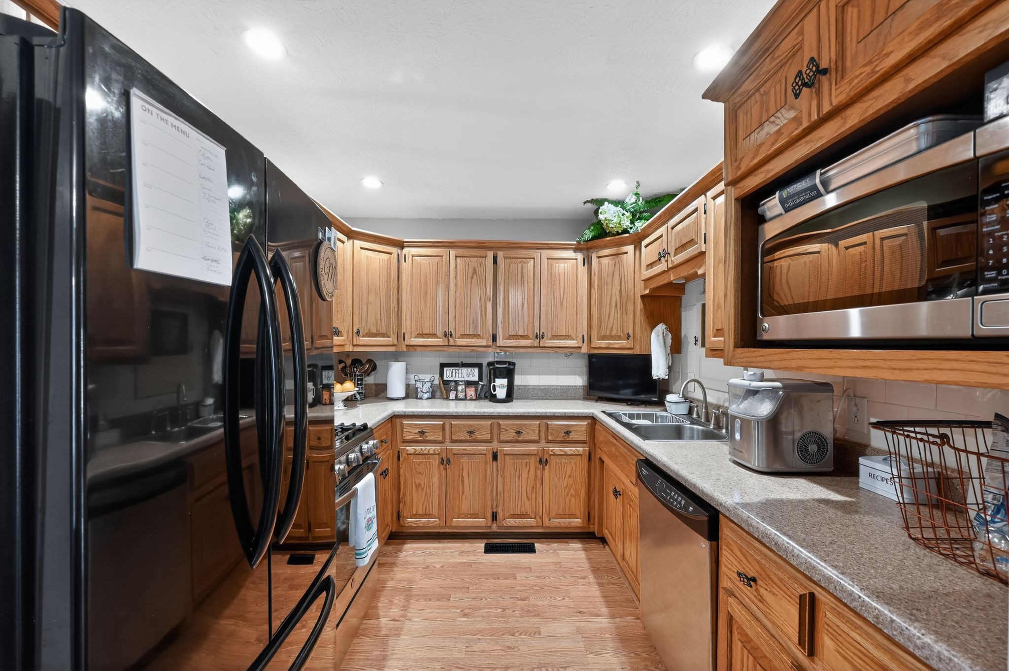 190 Hooper Road Smithville, TN 37166 - Photo 10 of 32 a kitchen with stainless steel appliances a sink stove and refrigerator
