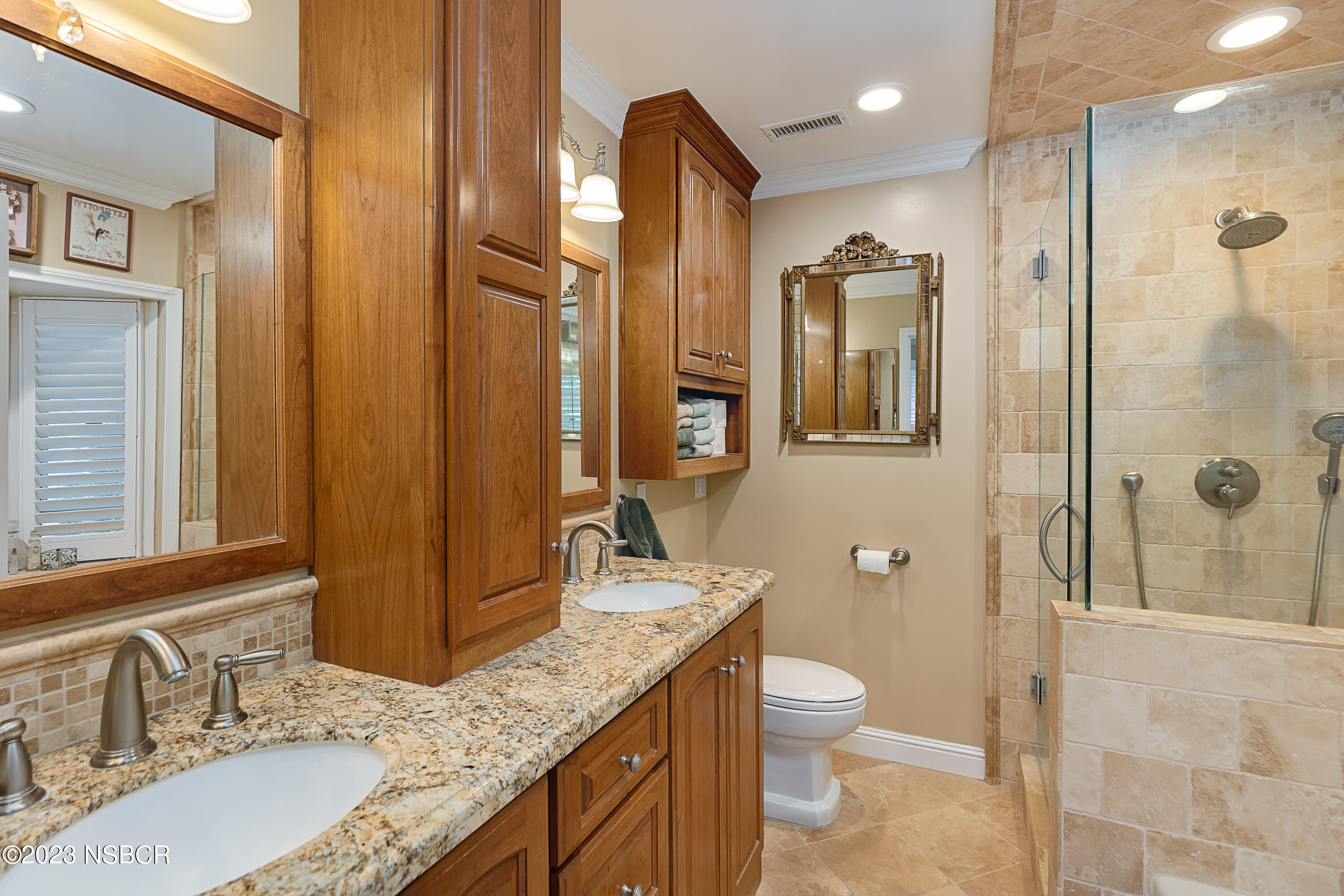629 Wakefield Road Goleta, CA 93117 - Photo 12 of 22 a bathroom with a granite countertop sink toilet and shower