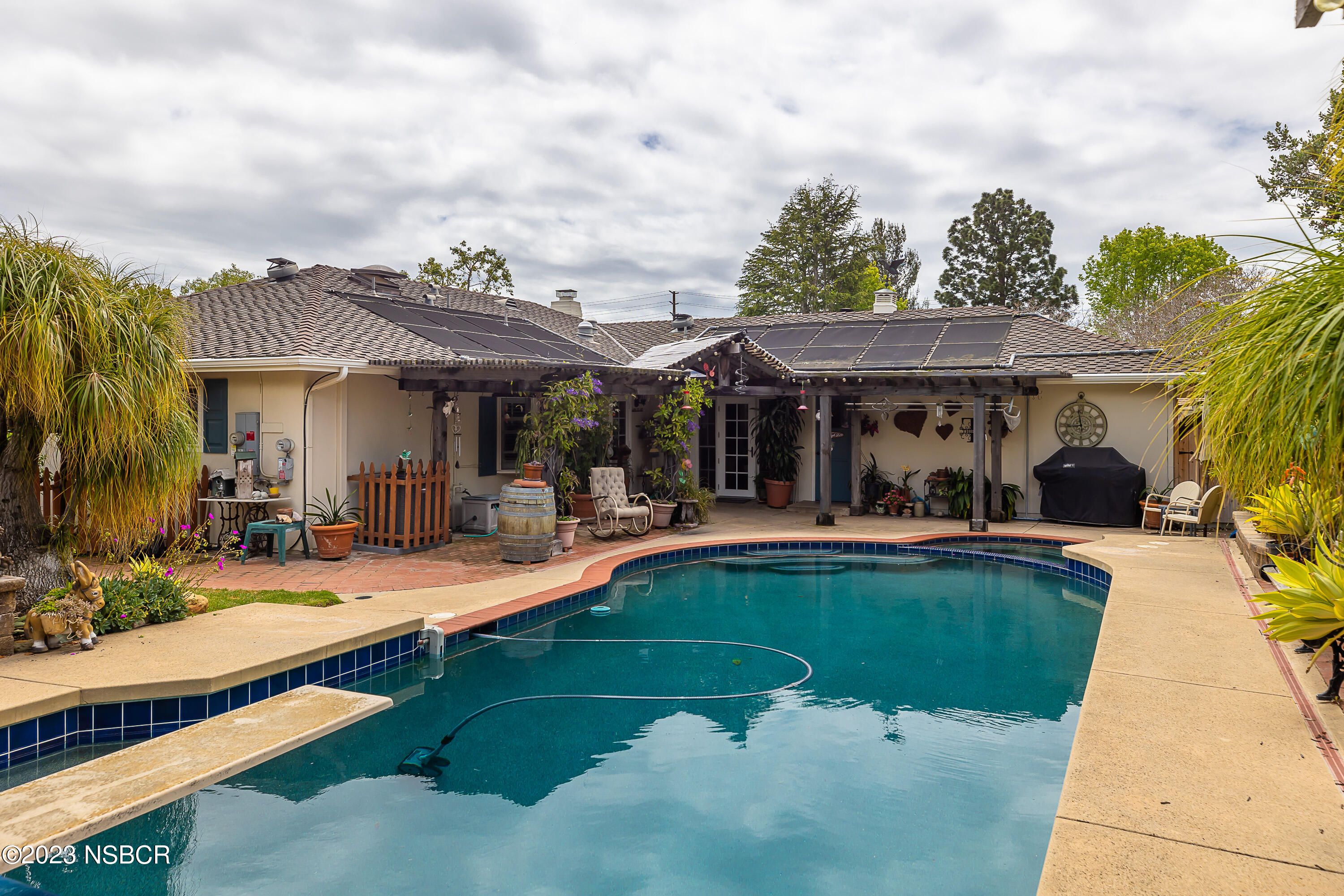 629 Wakefield Road Goleta, CA 93117 - Photo 20 of 22 a view of a patio with swimming pool table and chairs