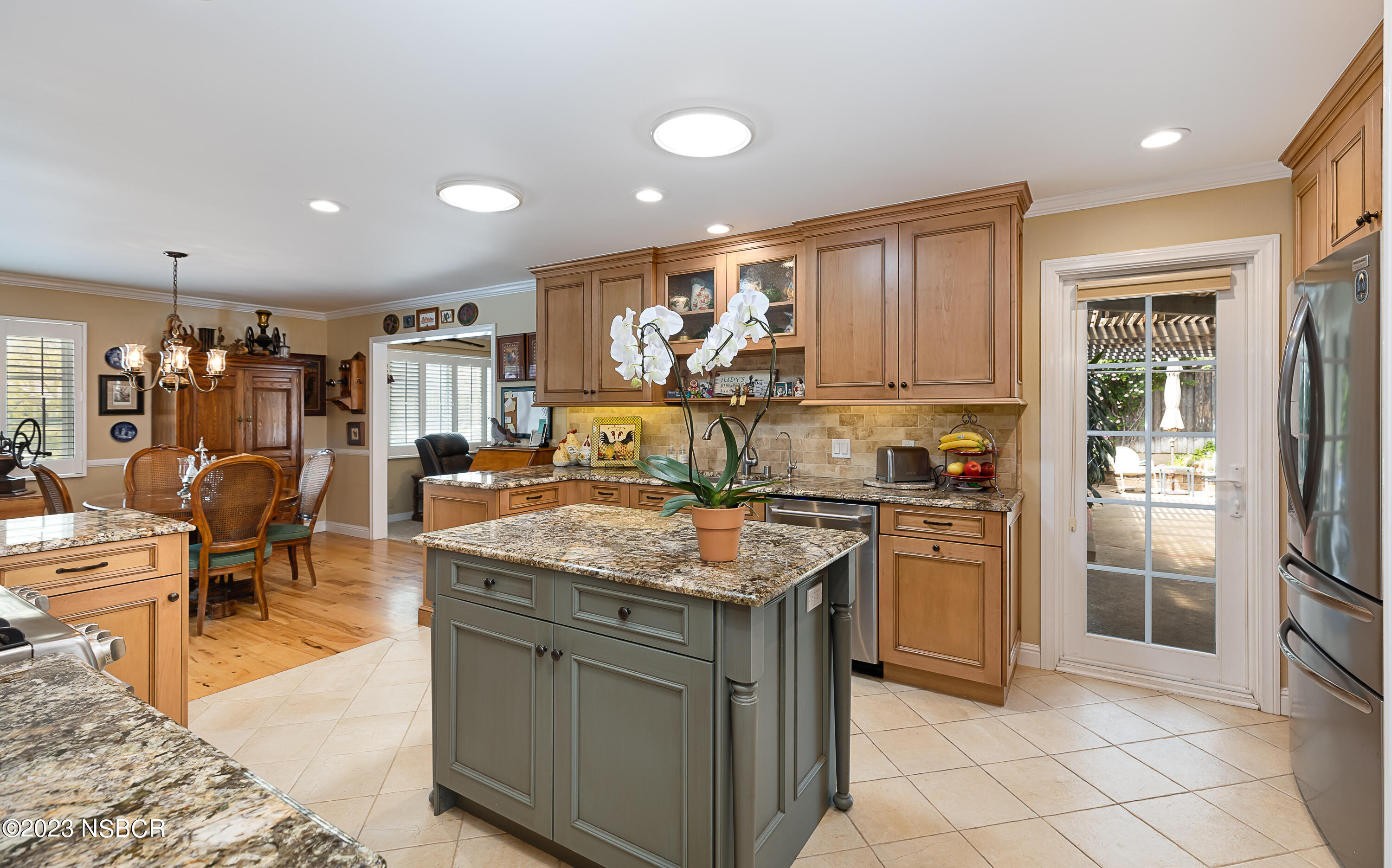 629 Wakefield Road Goleta, CA 93117 - Photo 7 of 22 a kitchen with stainless steel appliances granite countertop a stove and a refrigerator