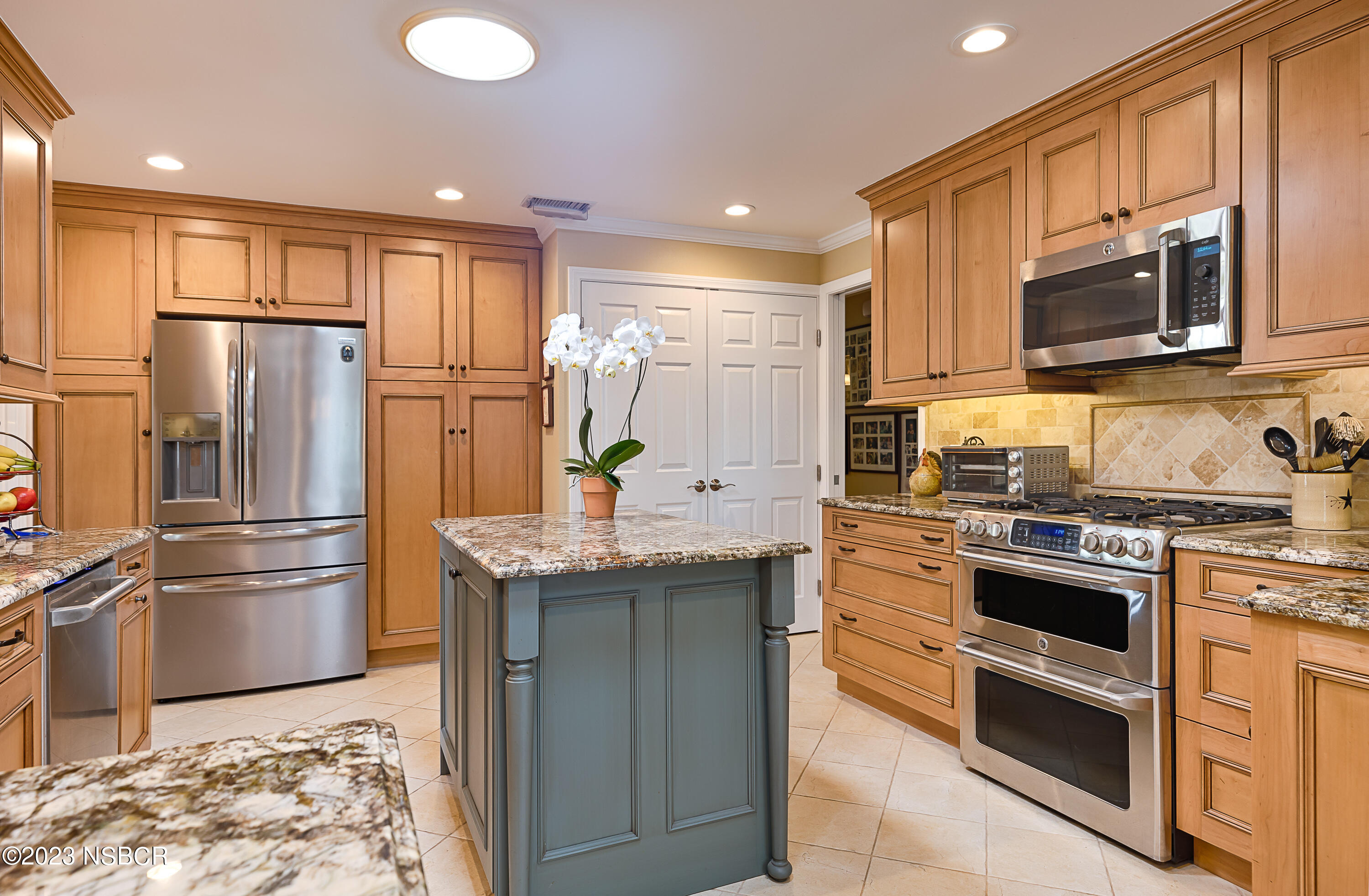 629 Wakefield Road Goleta, CA 93117 - Photo 8 of 22 a kitchen with stainless steel appliances granite countertop a refrigerator stove and sink