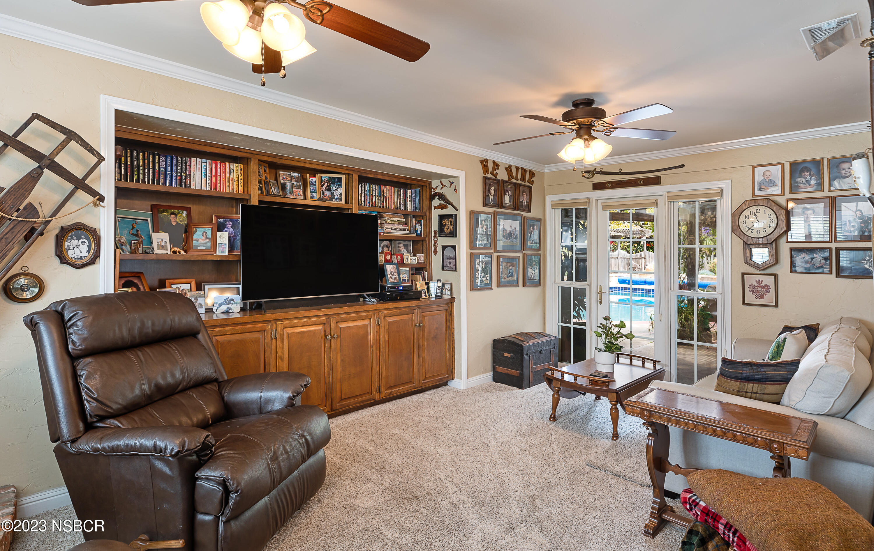 629 Wakefield Road Goleta, CA 93117 - Photo 9 of 22 a living room with furniture a ceiling fan and a flat screen tv
