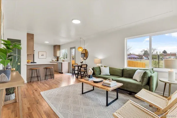 a living room with furniture and a table