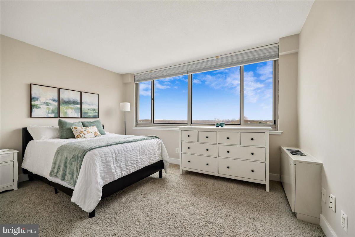 1220 Blair Mill Road, Unit 804 Silver Spring, MD 20910 - Photo 10 of 18 a bedroom with a bed and a dresser