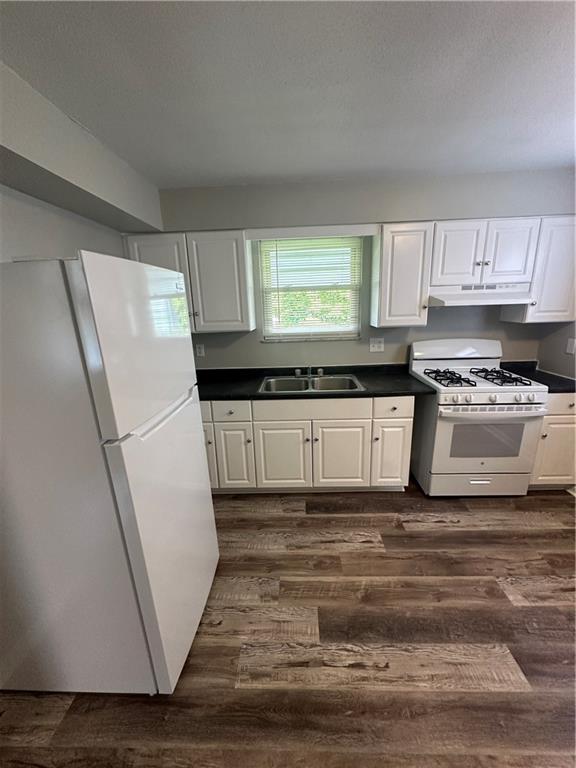 908 Russellwood Avenue McKees Rocks, PA 15136 - Photo 13 of 33 a kitchen with granite countertop a refrigerator sink and cabinets