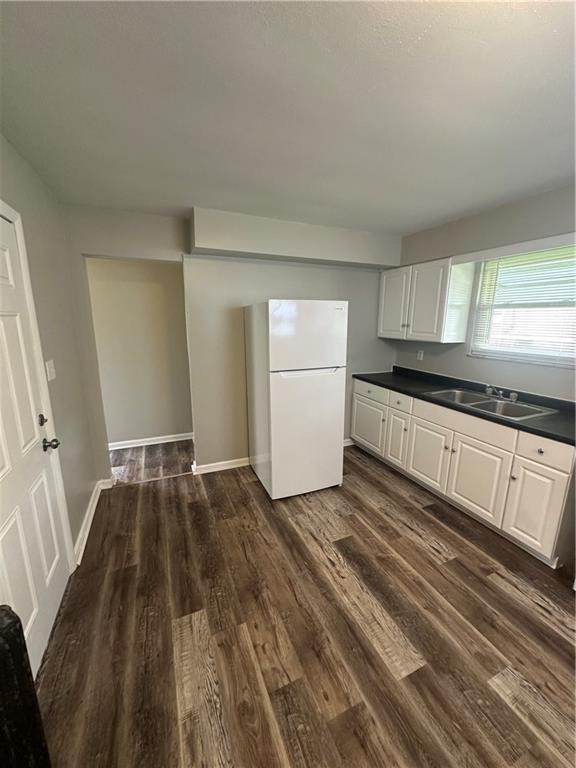 908 Russellwood Avenue McKees Rocks, PA 15136 - Photo 16 of 33 a kitchen with granite countertop white cabinets and wooden floor