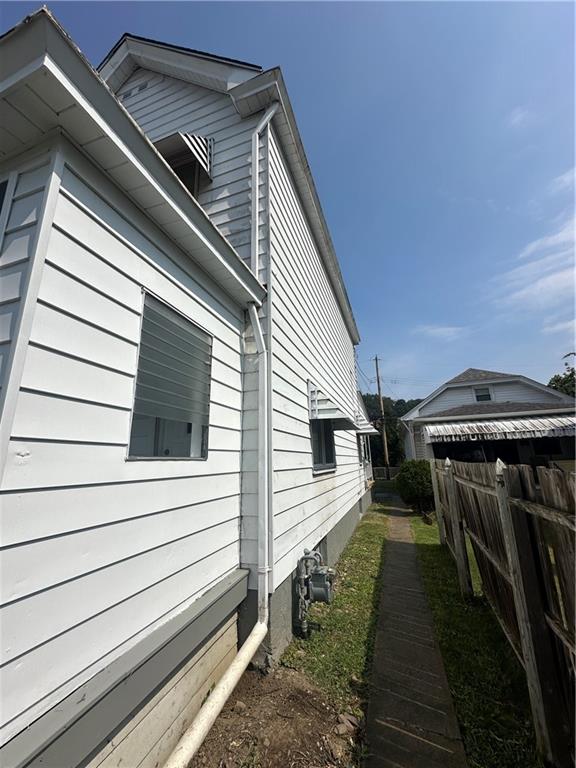 908 Russellwood Avenue McKees Rocks, PA 15136 - Photo 2 of 33 a view of a house with a door and deck