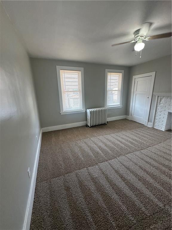 908 Russellwood Avenue McKees Rocks, PA 15136 - Photo 22 of 33 en empty room with windows and fan