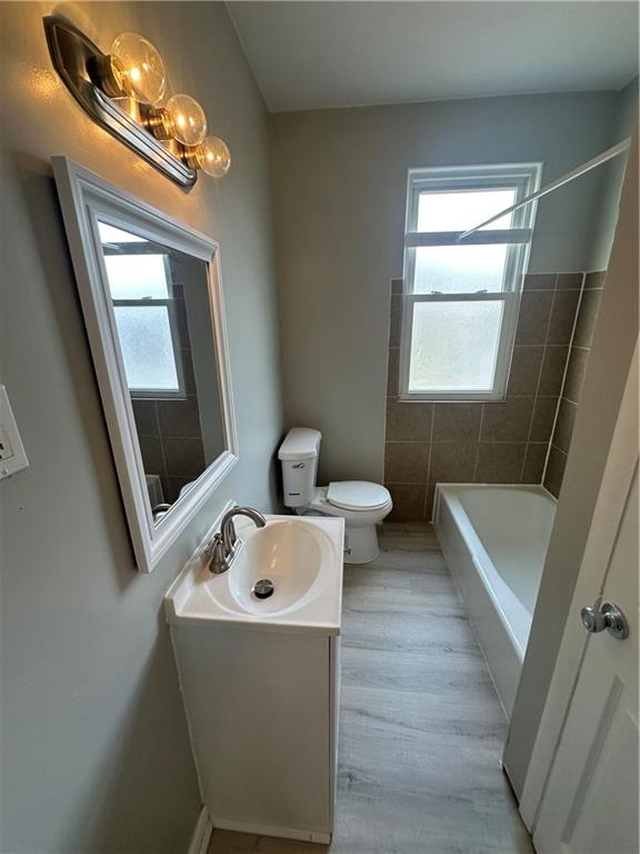 908 Russellwood Avenue McKees Rocks, PA 15136 - Photo 27 of 33 a bathroom with a sink a mirror and a bathtub