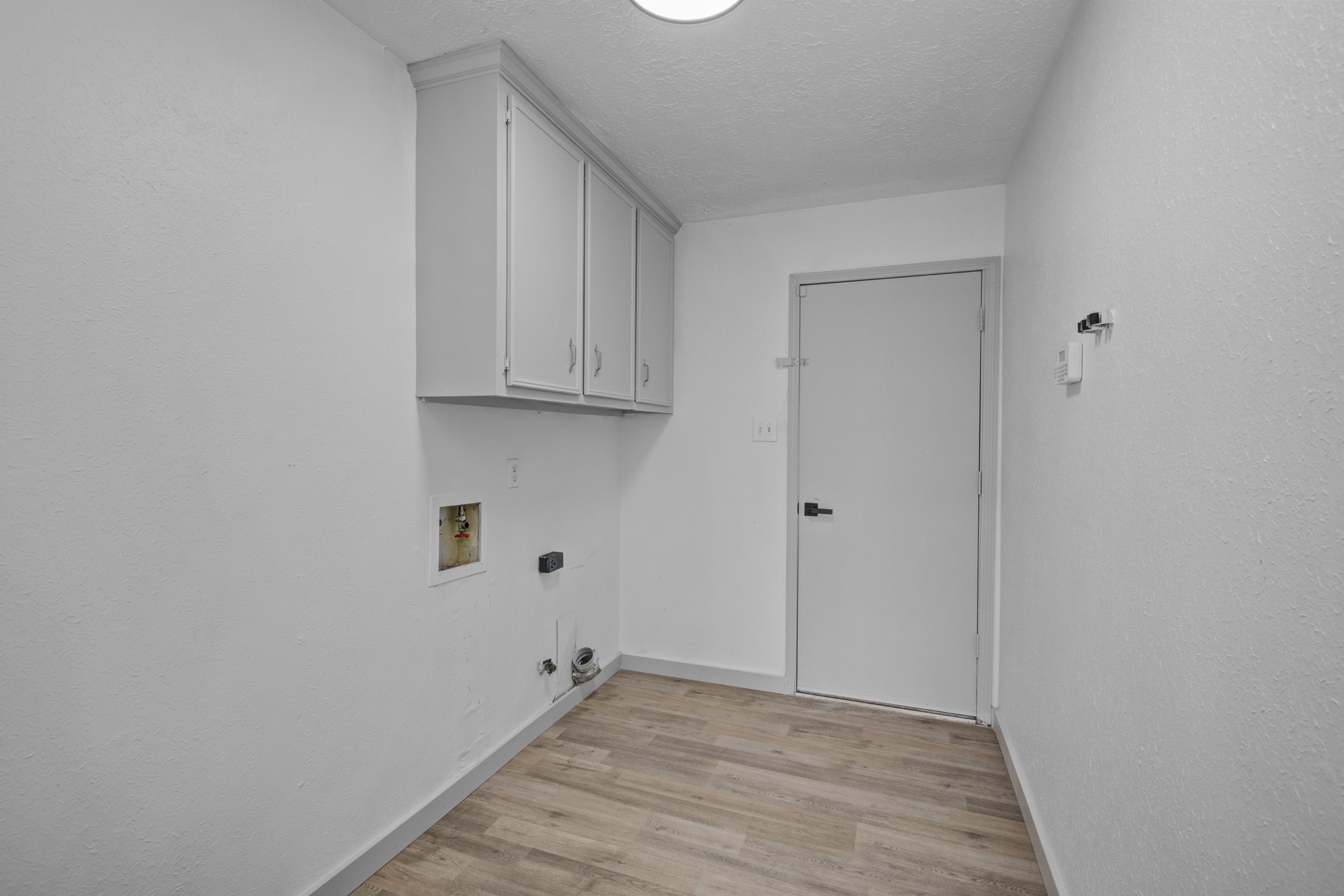 13747 Rampchester Lane Houston, TX 77015 - Photo 5 of 24 a view of a room with wooden floor and closet