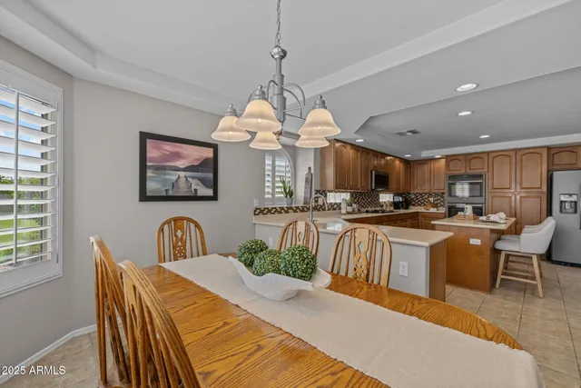 a living room with furniture flat screen tv and wooden floor