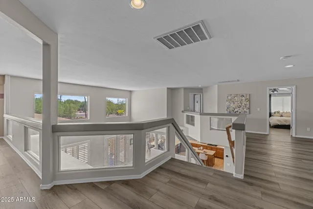 a kitchen with stainless steel appliances granite countertop a refrigerator a sink and a counter space