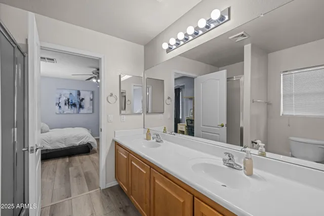 a view of a house with backyard and a tree