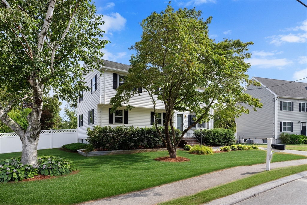 30 Samoset Road Woburn, MA 01801 - Photo 1 of 35 a front view of a house with a garden